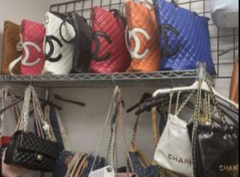 A display of counterfeit designer bags, featuring Chanel and other high-end brands, confiscated from Ronald Axelrod’s business as part of a $200,000 seizure by the Palm Beach County Sheriff's Office. (Credit: PBSO)