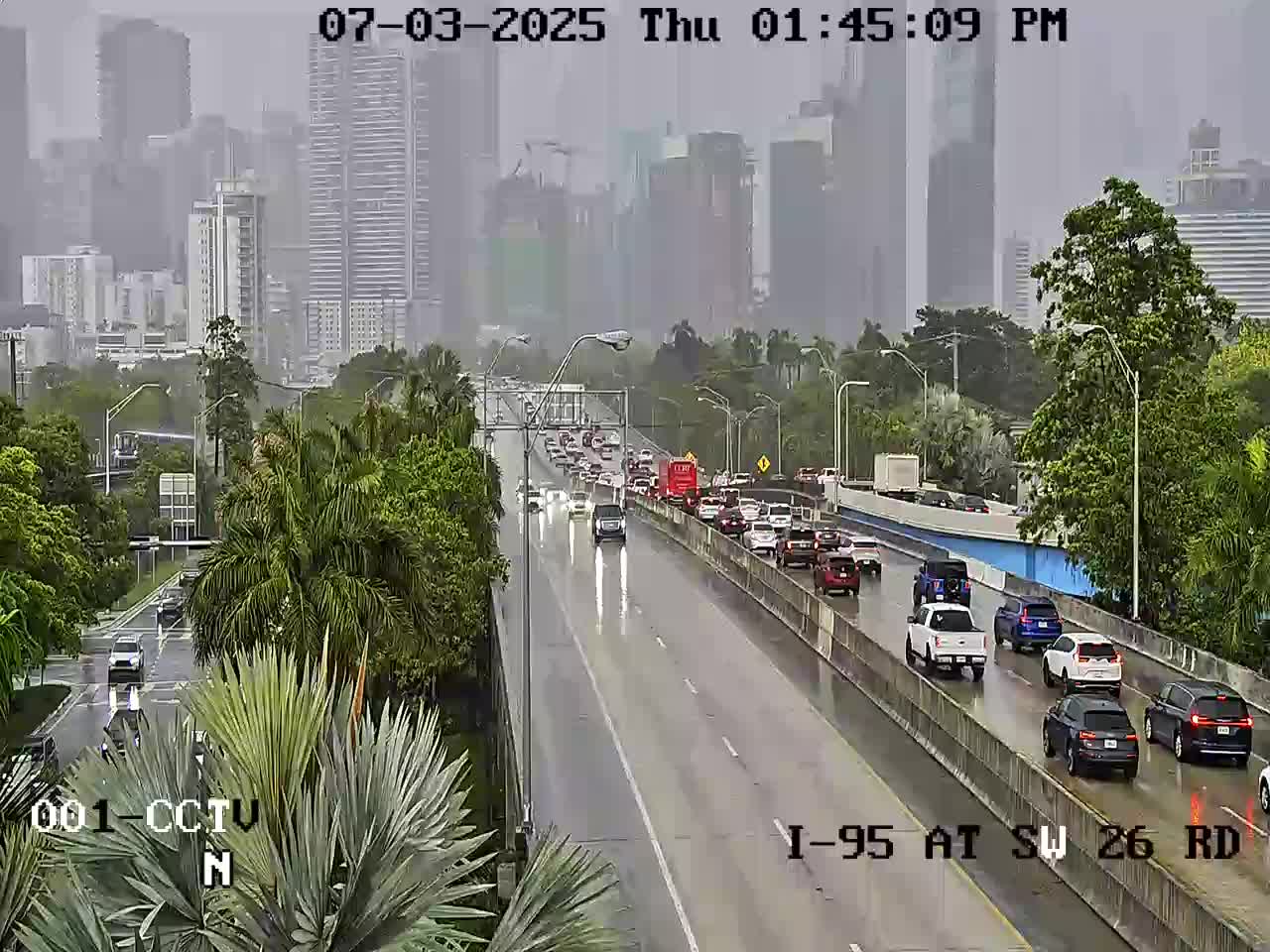 Florida Department of Transportation traffic camera of I-95 South depicting wet roads leading to downtown Miami.